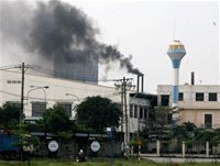 A company at Tan Binh Industrial Park in HCMC’s Tan Binh District emits black smoke into the air.
